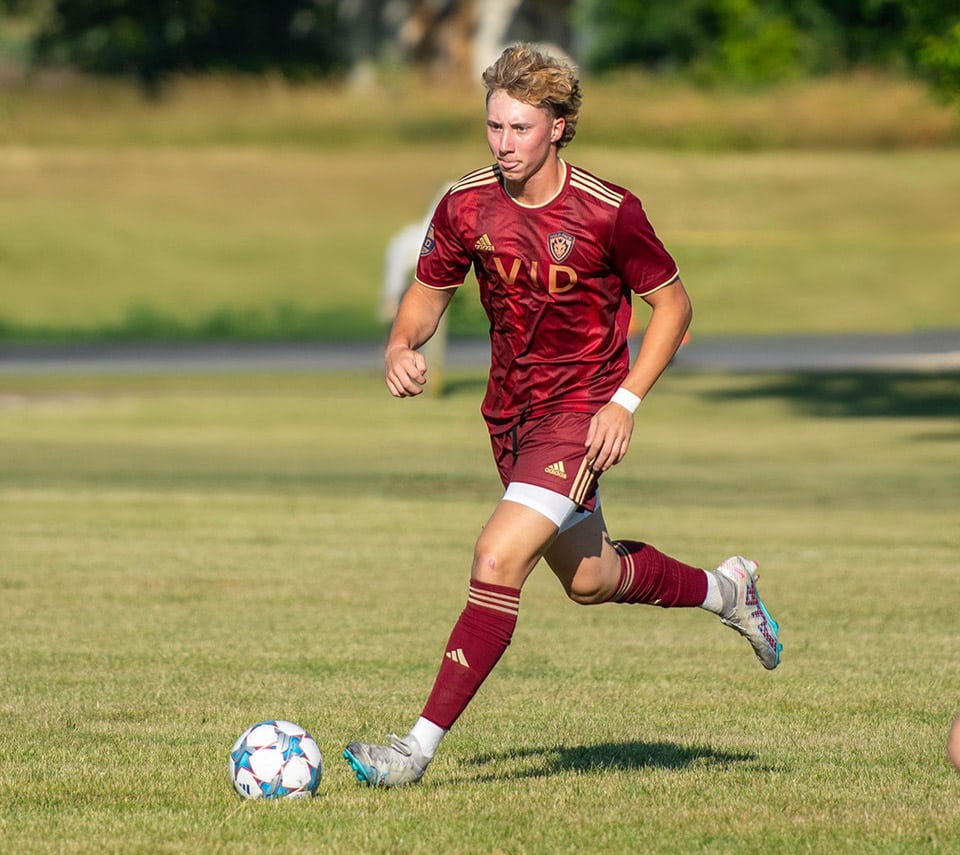 Wolfpack player in the 2024 burgundy kit